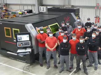 The Amada employees in Haan are very happy about the sale of the 100th machine. Ventis-3015AJ with LBC © Amada
