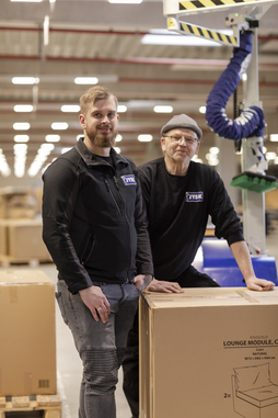 Bastian Böhm (left), Operations Manager, and Hans-Christian Hessler, Representative for Severely Disabled Employees, in the logistics warehouse of the JYSK Group. © Schmalz