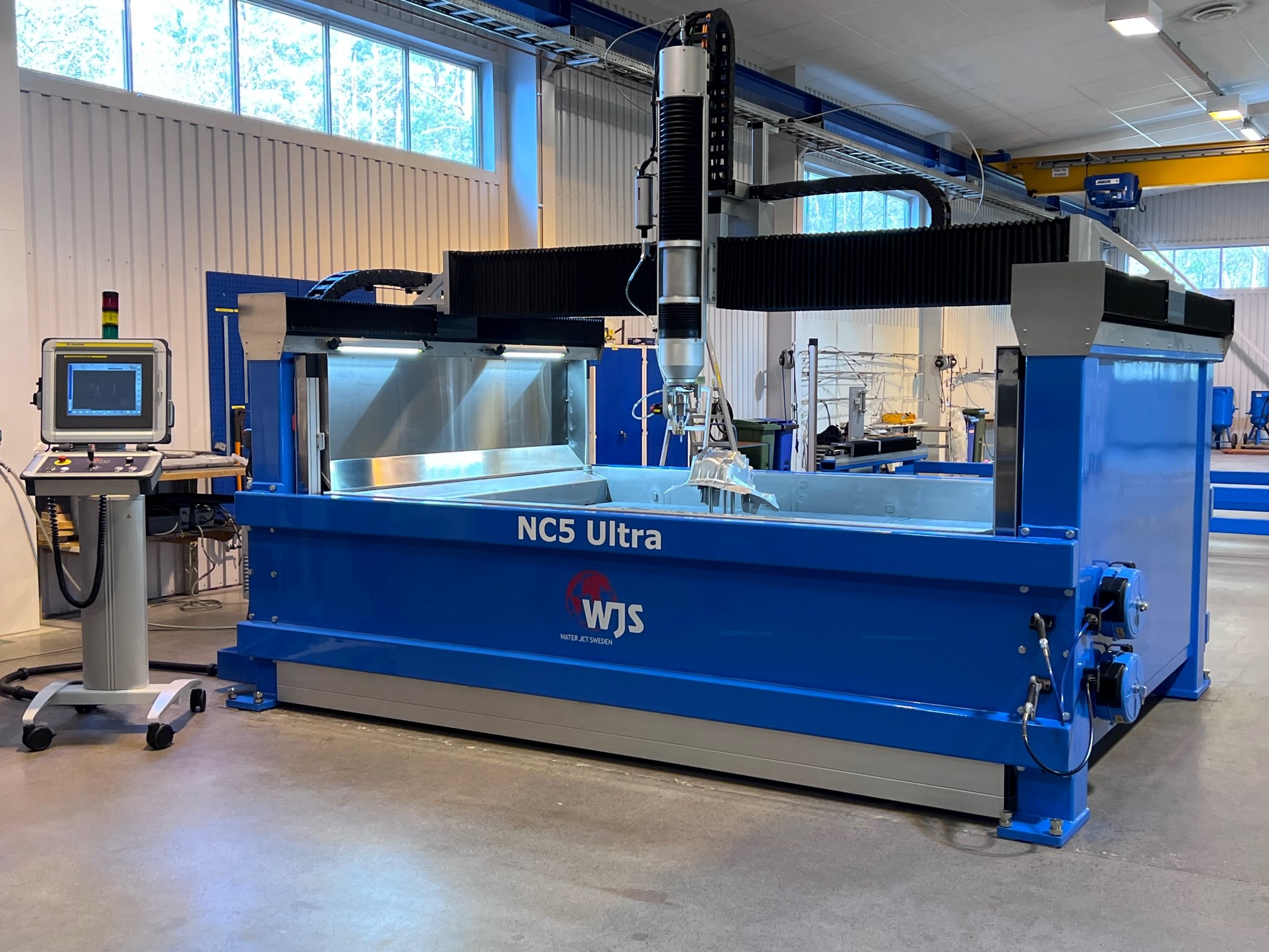 The NC5 Ultra is a compact and slimmer version of the large FiveX 3-D cutting machine. © Waterjet Sweden