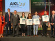 They are delighted to have won the award (from left). Kristina zur Mühlen (moderator), Dr. Claus Schnitzler, Ulrich Berners (both AKL board members), Dr. Anne Michel, Romina Villella, Daniel Bold, Dr. Tobias Dyck (all 4Jet Microtech) and Dr. Markus Kogel-Hollacher (Managing Director AKL). © Fraunhofer ILT/Andreas Steindl
